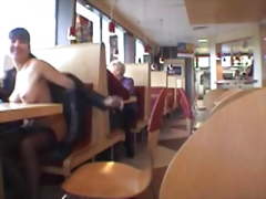 Busty babe flashing in a restaurant